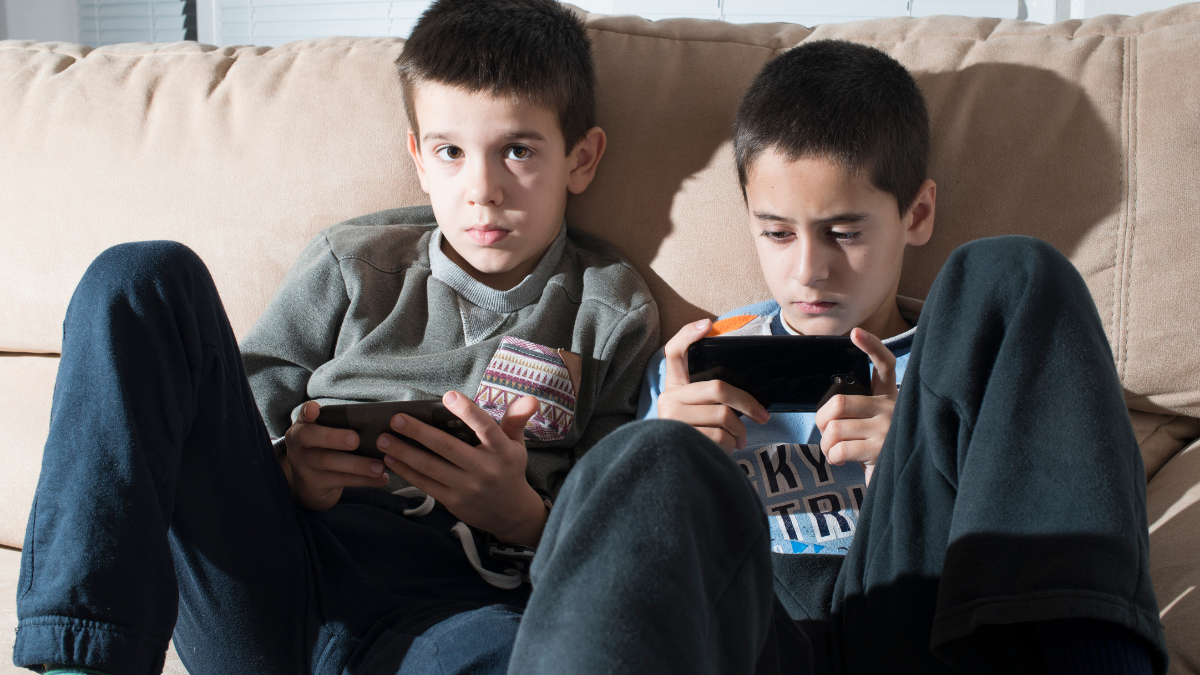 Which disease is causing the habit of playing mobile games in children?